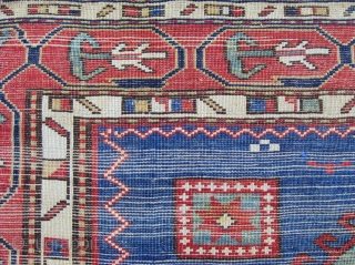 An elegant blue field Kazak rug with a particularly appealing border design.  Circa 1850, 5'1" x 8'4" 
              