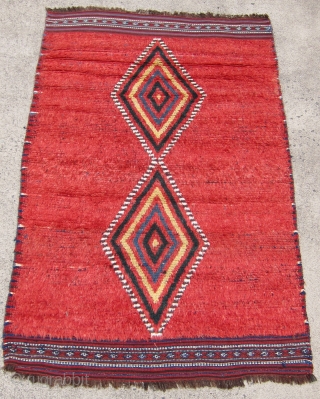 One of 6 dramatic and colorful sleeping rugs purchased from Baluchi tribesmen living in the area between Quetta and Kandahar. The rug measures 47" x 69".  The wool is long and  ...