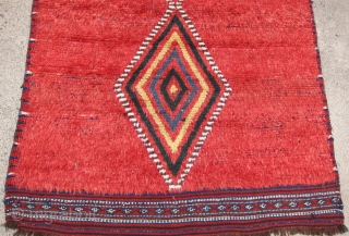 One of 6 dramatic and colorful sleeping rugs purchased from Baluchi tribesmen living in the area between Quetta and Kandahar. The rug measures 47" x 69".  The wool is long and  ...