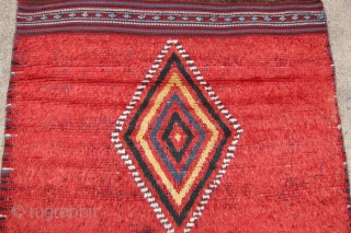 One of 6 dramatic and colorful sleeping rugs purchased from Baluchi tribesmen living in the area between Quetta and Kandahar. The rug measures 47" x 69".  The wool is long and  ...