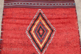 One of 6 dramatic and colorful sleeping rugs purchased from Baluchi tribesmen living in the area between Quetta and Kandahar. The rug measures 47" x 69".  The wool is long and  ...