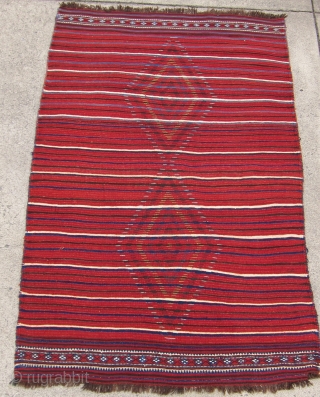 One of 6 dramatic and colorful sleeping rugs purchased from Baluchi tribesmen living in the area between Quetta and Kandahar. The rug measures 47" x 69".  The wool is long and  ...