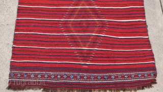 One of 6 dramatic and colorful sleeping rugs purchased from Baluchi tribesmen living in the area between Quetta and Kandahar. The rug measures 47" x 69".  The wool is long and  ...