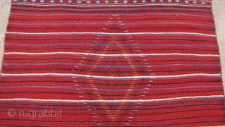 One of 6 dramatic and colorful sleeping rugs purchased from Baluchi tribesmen living in the area between Quetta and Kandahar. The rug measures 47" x 69".  The wool is long and  ...