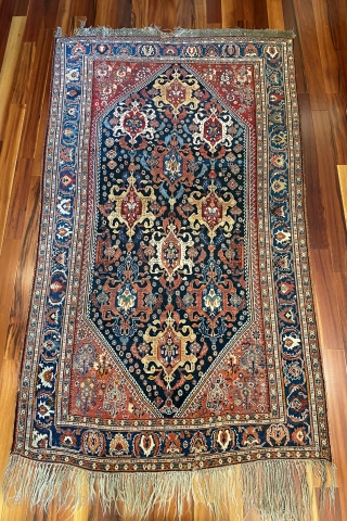Qashqai carpet circa 1880, 4'4" x 7'8".  Beautifully drawn medallions with balanced colors.  Good pile.  Damage to one end,small hole, minor repairs, but otherwise in very good condition.   ...
