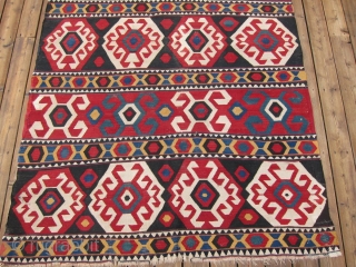 Zangadzor Region Kilim, S. Caucasus,  5'9" x 8'11".  A strikingly beautiful kilim with intense rich colors. There is a sleeve on the back for hanging. Minor restoration along the edges.  ...