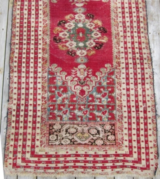 2nd half 19th c. Turkish Kirshehir rug, 44" x 88".  Lovely narrow borders surrounding a richly decorated central bouquet of flowers.           