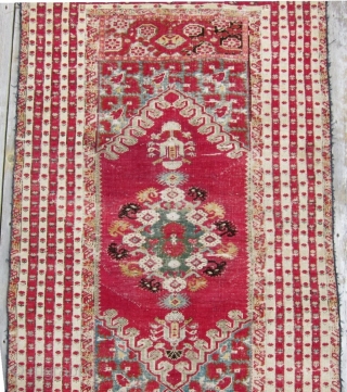 2nd half 19th c. Turkish Kirshehir rug, 44" x 88".  Lovely narrow borders surrounding a richly decorated central bouquet of flowers.           