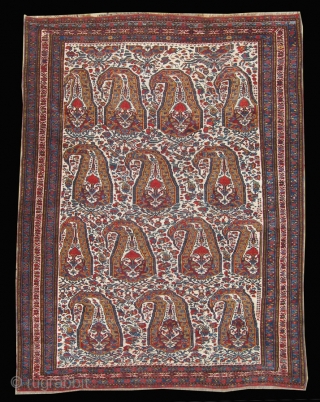 A beautiful shawl-inspired Khamseh boteh design rug with crisp colors against an ivory ground. Interesting floral filler between the botehs. Bottom 1" expertly restored and very small scattered re-knotting in field.  