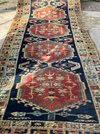 Vintage Azerbaijani Runner Rug – 360 × 103 cm

Beautiful vintage runner rug from Azerbaijan, featuring a striking traditional geometric design. The rug has a deep navy blue field with a sequence of  ...