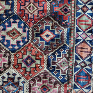 Shahsavan reverse soumak, 19c. Measures roughly 62cmx60cm. Excellent range of natural colours including cochineal. Comes with original back. Good condition ...some surface wear and minor side splitting... see pics. Great old piece.  ...