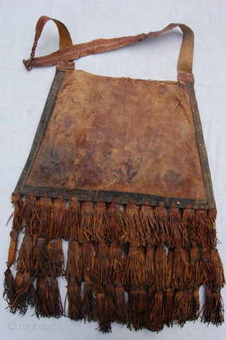 Antique tribal Malinese Touareq conical shaped leather bag. 46/33 x 30 cm (1ft 6"/1ft 1" x 1ft). Condition: good, original sides and back complete and intact, original leather tassels complete and intact,  ...