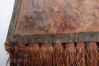 Antique tribal Malinese Touareq conical shaped leather bag. 46/33 x 30 cm (1ft 6"/1ft 1" x 1ft). Condition: good, original sides and back complete and intact, original leather tassels complete and intact,  ...