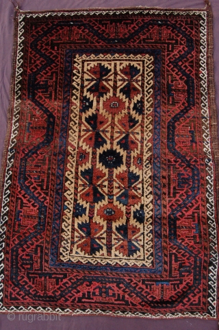Meaty camelground tribal Baluch rug 134 x 93 cm  (4ft 10" x 3ft 1") last quarter 19th century. All natural dyestuffs, colours: red, dark blue, blueish green, camel, brown, dark brown  ...