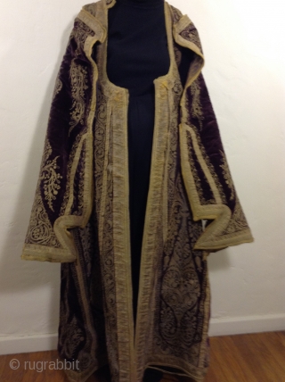 Full length Turkish woman's robe with open sleeves. Beautiful deep purple silk velvet with gold metal thread using couching style decoration.  I am guessing that it was made before the First  ...