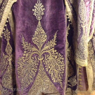 Full length Turkish woman's robe with open sleeves. Beautiful deep purple silk velvet with gold metal thread using couching style decoration.  I am guessing that it was made before the First  ...