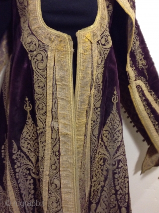 Full length Turkish woman's robe with open sleeves. Beautiful deep purple silk velvet with gold metal thread using couching style decoration.  I am guessing that it was made before the First  ...