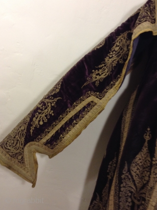 Full length Turkish woman's robe with open sleeves. Beautiful deep purple silk velvet with gold metal thread using couching style decoration.  I am guessing that it was made before the First  ...