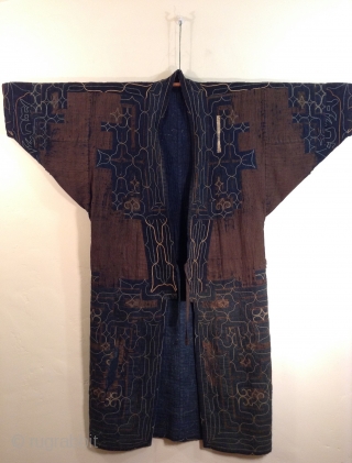 This robe was made by the indigenous people living on the northern most island of Japan. Both men and women wore these robes which are a form of appliche. the blue cotton  ...