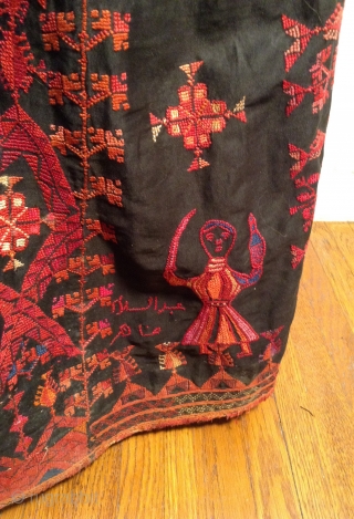 This is a beautiful Palestinian embroidered dress. it has a signature at the bottom and it is in perfect condition. i tried to highlight a photo of the embroidered signature plus a  ...