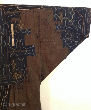 This robe was made by the indigenous people living on the northern most island of Japan. Both men and women wore these robes which are a form of appliche. the blue cotton  ...