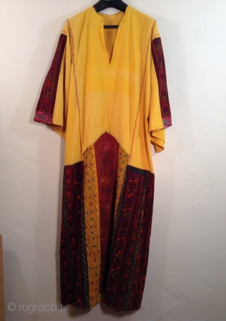 This is a very finely embroidered Arab Woman's dress from the area called the West Bank of Israel. The design and quality of the embroidery makes it possible to identify what town  ...