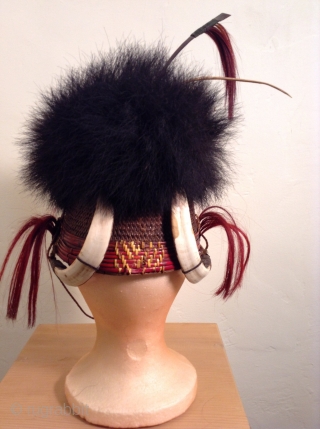 This is a rare headpiece from Nagaland which is a state in Northeast India.  It was used as a ceremonial warrior's hat.  There are four tusks on the headpiece which  ...