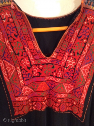 This is a Palestinian dress stemming from the 1930s.  It has been embroidered on the original black fabric and remains in very good condition.  It has been carefully handled in  ...