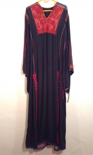 This is a Palestinian dress stemming from the 1930s.  It has been embroidered on the original black fabric and remains in very good condition.  It has been carefully handled in  ...