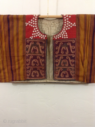 Indonesian vest probably from Sumatra.  Excellent condition, beautifully woven and trimmed with Cowrie Shells.  Can be worn by a small person who would benefit by having very long arms.   ...