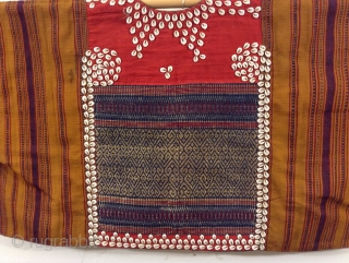 Indonesian vest probably from Sumatra.  Excellent condition, beautifully woven and trimmed with Cowrie Shells.  Can be worn by a small person who would benefit by having very long arms.   ...