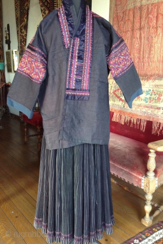 This is a jacket made by the Miao people, one of the largest minority groups in China.  It is an Indigo dyed cotton fabric which is very dark blue-black.  The  ...