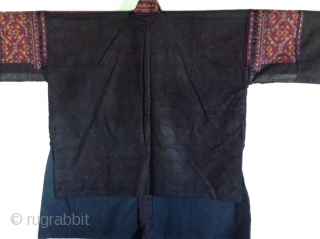 This is a jacket made by the Miao people, one of the largest minority groups in China.  It is an Indigo dyed cotton fabric which is very dark blue-black.  The  ...