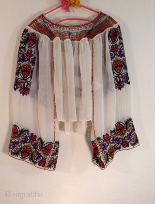 This is a very beautiful and rare Roumanian blouse made between the two Worild Wars in one specific village in Roumania.
The embroidery is extremely tiny and dense with black yarn used to  ...