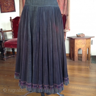 This is a skirt which wraps around the waist like an apron and makes a 360 degree circle when opened up. It was made by one of the minority groups in China  ...