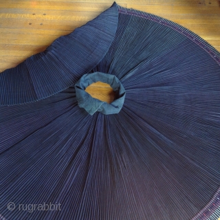 This is a skirt which wraps around the waist like an apron and makes a 360 degree circle when opened up. It was made by one of the minority groups in China  ...