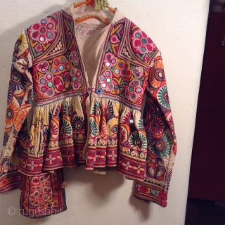 This is a child's dress from Gujarat, India.  It is a wrap around dress that looks to be about a size 3 to 5.  It is in very good condition  ...