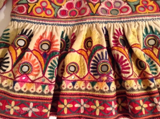 This is a child's dress from Gujarat, India.  It is a wrap around dress that looks to be about a size 3 to 5.  It is in very good condition  ...