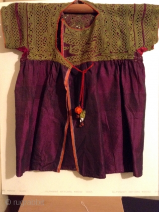 This is a beautiful little dress for about a 3 to 5 year old from India with very fine small mirror work on purple silk.  It is in great condition.   ...