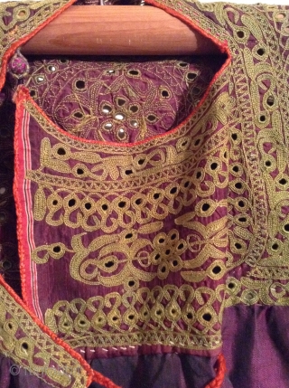 This is a beautiful little dress for about a 3 to 5 year old from India with very fine small mirror work on purple silk.  It is in great condition.   ...