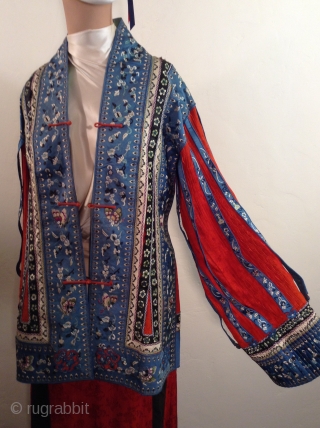 This is a very unusual Chinese suit  mixing a traditional Chinese style pleated and embroidered silk skirt with a more Western style 
jacket..  It was probably custom made for an  ...