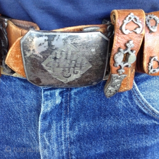 Afghanistan horseman's leather belt.  Very unusual. Beautifully decorated with silver pieces.  There are 4 pouches, 2 for money and 2 for knives or other utensils.  The buckle Is silver  ...