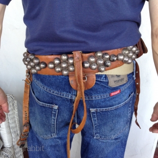Afghanistan horseman's leather belt.  Very unusual. Beautifully decorated with silver pieces.  There are 4 pouches, 2 for money and 2 for knives or other utensils.  The buckle Is silver  ...