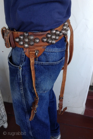 Afghanistan horseman's leather belt.  Very unusual. Beautifully decorated with silver pieces.  There are 4 pouches, 2 for money and 2 for knives or other utensils.  The buckle Is silver  ...