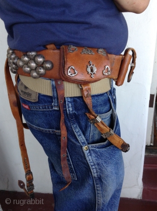 Afghanistan horseman's leather belt.  Very unusual. Beautifully decorated with silver pieces.  There are 4 pouches, 2 for money and 2 for knives or other utensils.  The buckle Is silver  ...