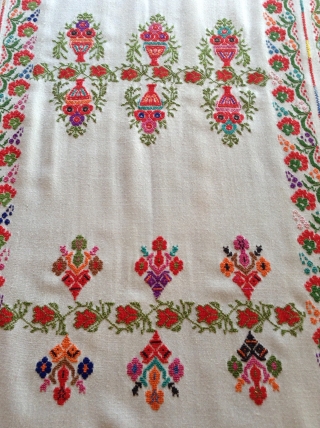 This is a  Palestinian wedding shawl.  It dates from about the early to mid 20th century.  The embroidery is a cross stitch and the colors are very vibrant as  ...