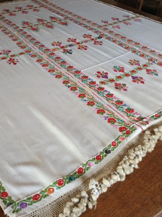 This is a  Palestinian wedding shawl.  It dates from about the early to mid 20th century.  The embroidery is a cross stitch and the colors are very vibrant as  ...