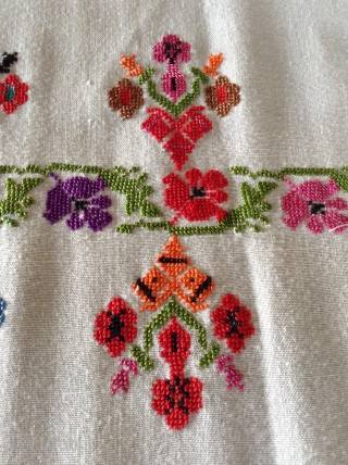 This is a  Palestinian wedding shawl.  It dates from about the early to mid 20th century.  The embroidery is a cross stitch and the colors are very vibrant as  ...