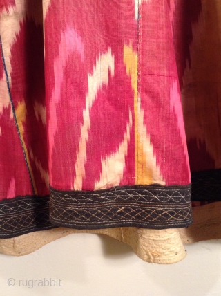 This is an Uzbek ikat silk dress with very traditional colors.  It is in very good condition and would fit a large woman.         