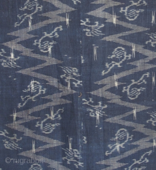 Japanese Kimono, very fine indigo color. I believe the fabric is ramie. It is an Ikat called Katsuri.  

Excellent condition even though it is old.  There is one patch which  ...